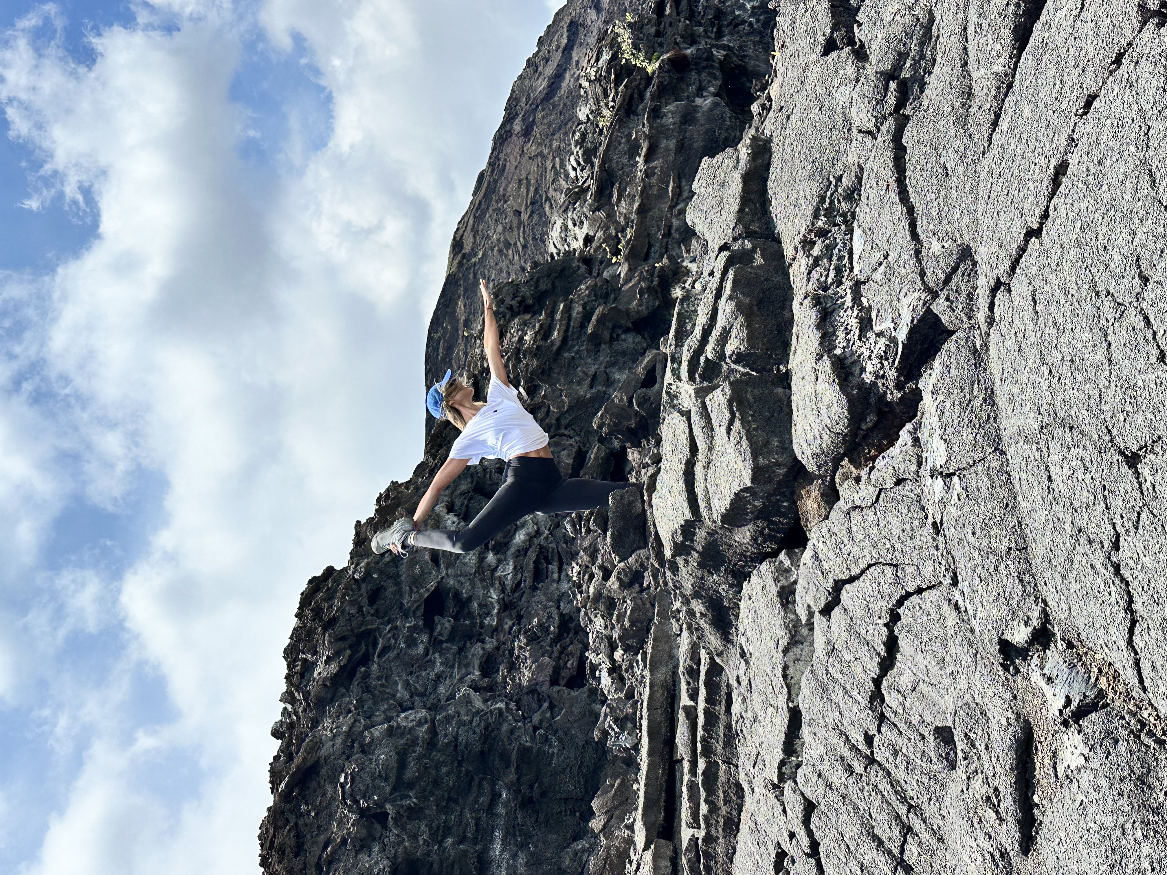 Dr. Lean practicing yoga on lava rocks in Hawaii, 2025